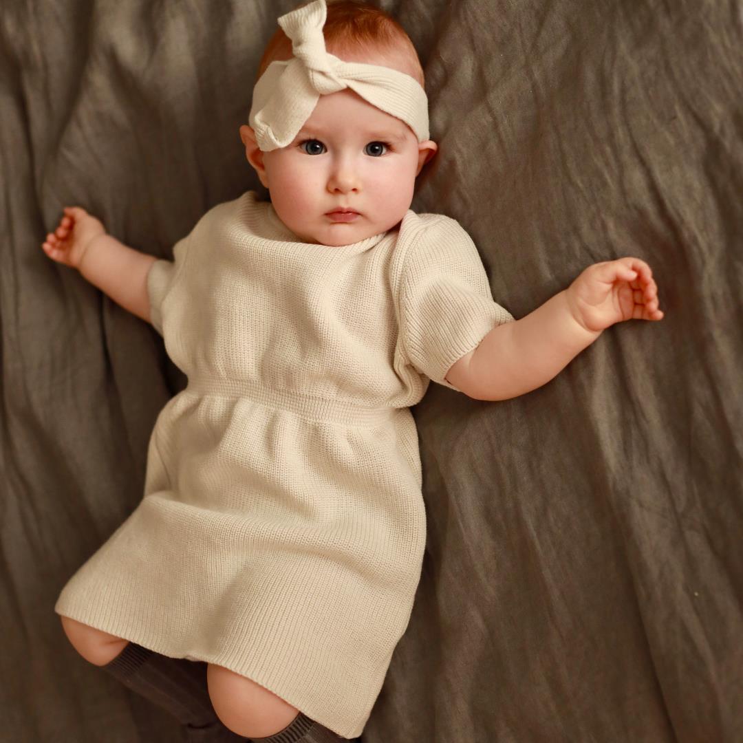 كريم فستان محبوك للأطفال والرضع من القطن العضوي